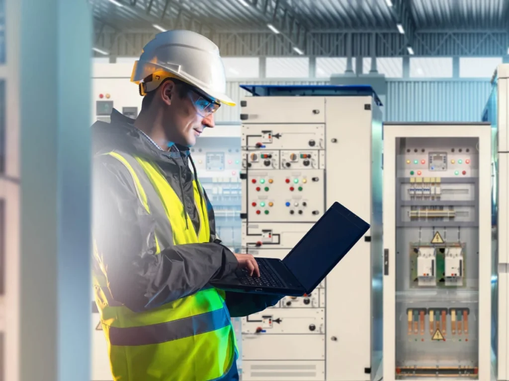 Engineer inspecting an electrical control panel